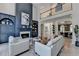 Bright and open living room with fireplace, custom built-ins, and second floor at 7920 Tintern Trce, Duluth, GA 30097