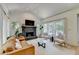 Bright living space with fireplace, hardwood floors, and natural light at 7920 Tintern Trce, Duluth, GA 30097