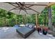 Outdoor lounge area with comfortable seating and shade umbrella at 7920 Tintern Trce, Duluth, GA 30097