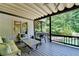 Relaxing outdoor patio with comfortable seating and a view of the water at 7920 Tintern Trce, Duluth, GA 30097