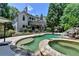 Inviting backyard pool and spa with waterfall feature and lush landscaping at 7920 Tintern Trce, Duluth, GA 30097