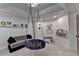 Bright room with a whimsical indoor swing and cozy seating area at 7920 Tintern Trce, Duluth, GA 30097