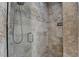 Walk-in shower featuring tile walls, glass door, and shower head at 7920 Tintern Trce, Duluth, GA 30097
