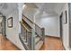 Gray and white staircase with hardwood floors and neutral paint at 7920 Tintern Trce, Duluth, GA 30097