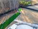 Aerial view of backyard featuring artificial turf area, surrounded by mature trees and a privacy fence at 149 Avalon Way, Sharpsburg, GA 30277