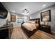 Cozy bedroom with hardwood floors, neutral tones, modern fixtures, and tasteful decor at 149 Avalon Way, Sharpsburg, GA 30277