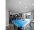 Bright game room featuring a pool table and a variety of arcade games at 149 Avalon Way, Sharpsburg, GA 30277