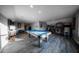 Expansive game room with a pool table, arcade machines, and ample space for recreation at 149 Avalon Way, Sharpsburg, GA 30277