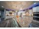 Bright, open kitchen featuring granite countertops, a large island, and stainless steel appliances at 149 Avalon Way, Sharpsburg, GA 30277