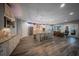 Open-concept kitchen featuring a large island, stainless steel appliances, and modern lighting at 149 Avalon Way, Sharpsburg, GA 30277