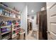 This laundry room is equipped with modern appliances and ample storage on shelves at 149 Avalon Way, Sharpsburg, GA 30277