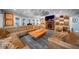 Bright living room boasts a ceiling fan, fireplace, and a large, comfortable sectional sofa at 149 Avalon Way, Sharpsburg, GA 30277