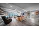 Open concept living room with fireplace, recessed lighting, and stylish decor at 149 Avalon Way, Sharpsburg, GA 30277
