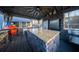 Outdoor kitchen with a stone island, built-in grill, and stainless steel appliances at 149 Avalon Way, Sharpsburg, GA 30277