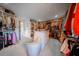 Large walk-in closet featuring custom shelving, hanging rods, and center island at 149 Avalon Way, Sharpsburg, GA 30277
