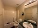 Functional bathroom with a shower-tub combination and ample vanity space at 160 Goldleaf Dr, Hampton, GA 30228