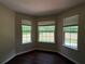 Cozy dining area bathed in natural light, featuring hardwood floors and a serene outdoor view at 160 Goldleaf Dr, Hampton, GA 30228