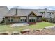 Spacious backyard with a concrete patio and view of the home's exterior, ideal for gatherings at 2842 Sedgeview Ln, Buford, GA 30519