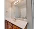 Bathroom with vanity, sink, and large mirror with modern lighting at 2842 Sedgeview Ln, Buford, GA 30519