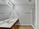 Bathroom featuring a large mirror, vanity, and walk-in shower at 2842 Sedgeview Ln, Buford, GA 30519