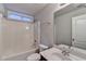 Bathroom featuring a tub/shower, toilet, and sink with vanity and large mirror at 2842 Sedgeview Ln, Buford, GA 30519