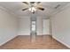 An airy bedroom with a ceiling fan and new LVP flooring throughout the room at 2842 Sedgeview Ln, Buford, GA 30519
