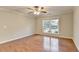 Large bedroom with LVP flooring, and a large window providing natural light at 2842 Sedgeview Ln, Buford, GA 30519