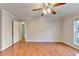 Comfortable bedroom featuring a ceiling fan, new flooring, and neutral paint at 2842 Sedgeview Ln, Buford, GA 30519
