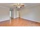 Bedroom with ceiling fan, crown molding, and doorway to ensuite bathroom with tub at 2842 Sedgeview Ln, Buford, GA 30519