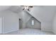 Bright bedroom featuring vaulted ceilings, neutral carpet, and a charming window with natural light at 2842 Sedgeview Ln, Buford, GA 30519