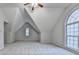A well-lit bedroom showcases unique architecture, with an arched window and neutral colored walls at 2842 Sedgeview Ln, Buford, GA 30519
