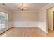 Formal dining room featuring hardwood floors, wainscoting, crown molding, and a classic chandelier at 2842 Sedgeview Ln, Buford, GA 30519
