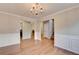 Spacious dining area with hardwood floors adjoins the living room with a fireplace at 2842 Sedgeview Ln, Buford, GA 30519
