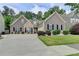 Charming two-story home with landscaped yard and welcoming curb appeal, complemented by a well-maintained driveway at 2842 Sedgeview Ln, Buford, GA 30519