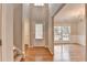 Inviting foyer with hardwood floors, a staircase, and an open view to the living spaces at 2842 Sedgeview Ln, Buford, GA 30519