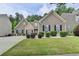 Charming single Gathering home with manicured lawn and mature landscaping at 2842 Sedgeview Ln, Buford, GA 30519