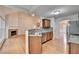 Modern kitchen with stainless steel sink, dishwasher, breakfast bar, and views to the living room at 2842 Sedgeview Ln, Buford, GA 30519