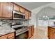 Bright kitchen with stainless appliances, stone counters, and a breakfast area with large windows at 2842 Sedgeview Ln, Buford, GA 30519