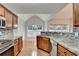 Beautiful kitchen featuring stainless steel appliances, stone countertops, and a mosaic backsplash at 2842 Sedgeview Ln, Buford, GA 30519
