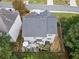 Aerial view of fenced backyard with patio area, green space, shed and neighboring houses at 3865 Brookhollow Dr, Douglasville, GA 30135