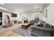 Spacious finished basement with modern design, comfortable seating, and a mounted television at 3865 Brookhollow Dr, Douglasville, GA 30135