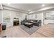 Open-concept finished basement with an entertainment center, gray sofa, and a stylish design at 3865 Brookhollow Dr, Douglasville, GA 30135