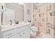 Clean bathroom with a marble vanity, decorative shower curtain, and crisp white door at 3865 Brookhollow Dr, Douglasville, GA 30135