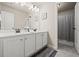 Bathroom with double sink, marble countertops, and access to the shower at 3865 Brookhollow Dr, Douglasville, GA 30135