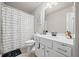 Bathroom featuring a marble countertop vanity with a unique shower curtain at 3865 Brookhollow Dr, Douglasville, GA 30135