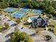 Aerial view of the community clubhouse, swimming pool, tennis courts and ample parking at 3865 Brookhollow Dr, Douglasville, GA 30135