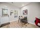 Bright dining area with natural light, complemented by modern furnishings and wood-look floors at 3865 Brookhollow Dr, Douglasville, GA 30135