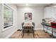 Eat-in kitchen area with lots of light, featuring a table for four and modern décor at 3865 Brookhollow Dr, Douglasville, GA 30135