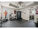 Home gym featuring an exercise machine, weights, motivational decor, and room for your furry friends at 3865 Brookhollow Dr, Douglasville, GA 30135