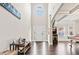 Grand foyer with high ceilings, dark wood floors, large arched window and a decorative entry table at 3865 Brookhollow Dr, Douglasville, GA 30135